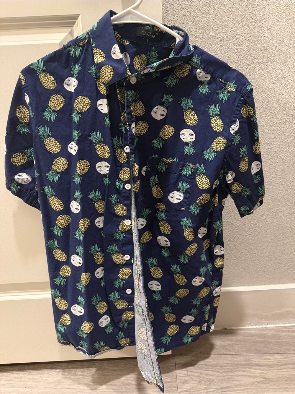 Blue pineapple collared button down shirt